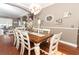 Farmhouse-style dining room with a large wooden table and chandelier at 355 Carriage Way Ct, Oviedo, FL 32765