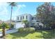 Two-story house with attached garage, landscaping, and American flag at 355 Carriage Way Ct, Oviedo, FL 32765