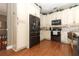 Modern kitchen with stainless steel appliances and cream-colored cabinetry at 355 Carriage Way Ct, Oviedo, FL 32765
