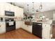 Spacious kitchen with copper farmhouse sink and granite countertops at 355 Carriage Way Ct, Oviedo, FL 32765