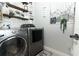 Laundry room with washer, dryer, and ample storage at 355 Carriage Way Ct, Oviedo, FL 32765