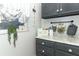Laundry room with granite countertop and dark cabinets at 355 Carriage Way Ct, Oviedo, FL 32765