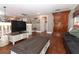 Bright living area with hardwood floors and built-in wooden cabinet at 355 Carriage Way Ct, Oviedo, FL 32765