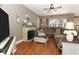 Spacious living room featuring a cozy fireplace and large sectional sofa at 355 Carriage Way Ct, Oviedo, FL 32765