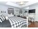 Spacious main bedroom with king bed and white dresser at 355 Carriage Way Ct, Oviedo, FL 32765
