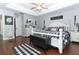 King-size bed in a well-lit main bedroom at 355 Carriage Way Ct, Oviedo, FL 32765