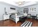 Large main bedroom with a king-size bed and wood flooring at 355 Carriage Way Ct, Oviedo, FL 32765