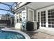 Inviting pool area with a Blackstone grill and covered patio at 355 Carriage Way Ct, Oviedo, FL 32765