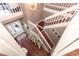 View of the two-story home's grand staircase at 355 Carriage Way Ct, Oviedo, FL 32765