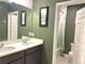 Bathroom with double vanity and a separate tub/shower at 3653 Yarian Dr, Haines City, FL 33844