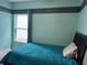 Bedroom with teal walls, a double bed, and a window at 3653 Yarian Dr, Haines City, FL 33844