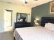 Main bedroom with king-size bed and access to bathroom at 3653 Yarian Dr, Haines City, FL 33844