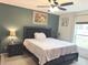 Main bedroom with king-size bed and ceiling fan at 3653 Yarian Dr, Haines City, FL 33844