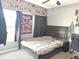 Bedroom featuring a double bed and anime decor at 3653 Yarian Dr, Haines City, FL 33844