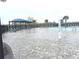 Relaxing community pool with lounge chairs and shaded areas at 3653 Yarian Dr, Haines City, FL 33844