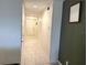 Bright hallway with tile floors and neutral walls at 3653 Yarian Dr, Haines City, FL 33844