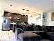 Open living room with L-shaped sectional sofa and kitchen views at 3653 Yarian Dr, Haines City, FL 33844