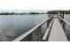 Peaceful lakefront gazebo with a wooden dock at 497 Oak Haven Dr, Altamonte Springs, FL 32701