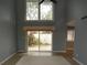 Spacious living room with high ceilings and sliding glass doors at 497 Oak Haven Dr, Altamonte Springs, FL 32701