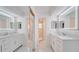 Modern bathroom with double vanity and marble floors at 5019 Nassau Cir # 5, Orlando, FL 32808