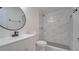 Modern bathroom with white vanity, marble shower, and updated fixtures at 5019 Nassau Cir # 5, Orlando, FL 32808