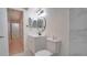 Updated bathroom with white vanity, toilet and marble accents at 5019 Nassau Cir # 5, Orlando, FL 32808