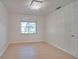 Bright bedroom with wood-look floors and a window at 5019 Nassau Cir # 5, Orlando, FL 32808