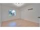 Bright bedroom with light wood flooring and large window at 5019 Nassau Cir # 5, Orlando, FL 32808