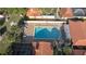 Community pool with surrounding patio furniture at 5019 Nassau Cir # 5, Orlando, FL 32808