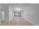 Dining room with hardwood floors and a large mirror reflecting the living room at 5019 Nassau Cir # 5, Orlando, FL 32808