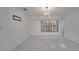 Bright living room with marble floors and large window at 5019 Nassau Cir # 5, Orlando, FL 32808