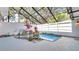 Private screened pool with lush landscaping at 5019 Nassau Cir # 5, Orlando, FL 32808