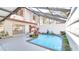 Inviting screened pool area, surrounded by tropical plants at 5019 Nassau Cir # 5, Orlando, FL 32808