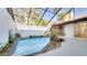 Inviting screened pool area with lush landscaping at 5019 Nassau Cir # 5, Orlando, FL 32808