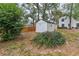 Backyard view of detached shed and landscaping at 5100 Neponset Ave, Orlando, FL 32808