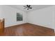 Bright bedroom with wood-look floors and ceiling fan at 5100 Neponset Ave, Orlando, FL 32808