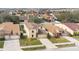 Aerial view of two story house with backyard and neighborhood at 533 Woods Landing Dr, Minneola, FL 34715