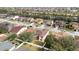 Aerial view of house and street, showcasing neighborhood at 533 Woods Landing Dr, Minneola, FL 34715