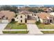Aerial view of a two-story house in a residential area at 533 Woods Landing Dr, Minneola, FL 34715