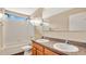 Bathroom with double sinks and a bathtub at 533 Woods Landing Dr, Minneola, FL 34715