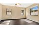 Bright bedroom with dark wood floors and ceiling fan at 533 Woods Landing Dr, Minneola, FL 34715
