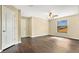 Spacious bedroom with dark wood floors and ceiling fan at 533 Woods Landing Dr, Minneola, FL 34715