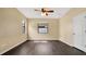 Spacious bedroom with dark wood floors and ceiling fan at 533 Woods Landing Dr, Minneola, FL 34715