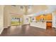 Open kitchen with island and stainless steel appliances at 533 Woods Landing Dr, Minneola, FL 34715