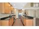 Open kitchen with island and stainless steel appliances at 533 Woods Landing Dr, Minneola, FL 34715