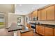 Kitchen with granite countertops and wood cabinets at 533 Woods Landing Dr, Minneola, FL 34715