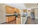 Open kitchen with island and stainless steel appliances at 533 Woods Landing Dr, Minneola, FL 34715