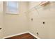 Laundry room with wire shelving and dark wood floors at 533 Woods Landing Dr, Minneola, FL 34715