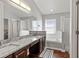 Elegant bathroom with granite countertops, double sinks, soaking tub, and separate shower at 562 Eagle Pointe S, Kissimmee, FL 34746