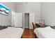 Bedroom with two twin beds, a desk and chair, and hardwood floors at 562 Eagle Pointe S, Kissimmee, FL 34746